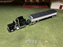 1/64 Black DCP 389 Peterbilt with 70 Sleeper & White Wilson Grain Trailer